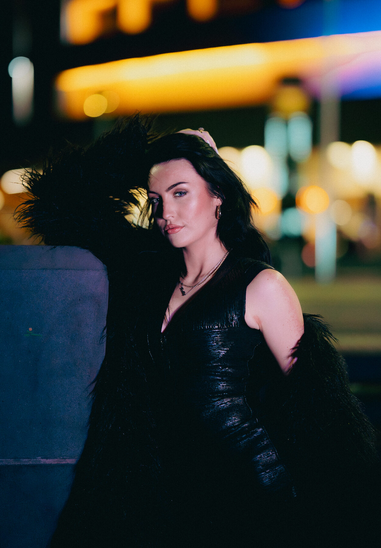 Black gown with gold bokeh