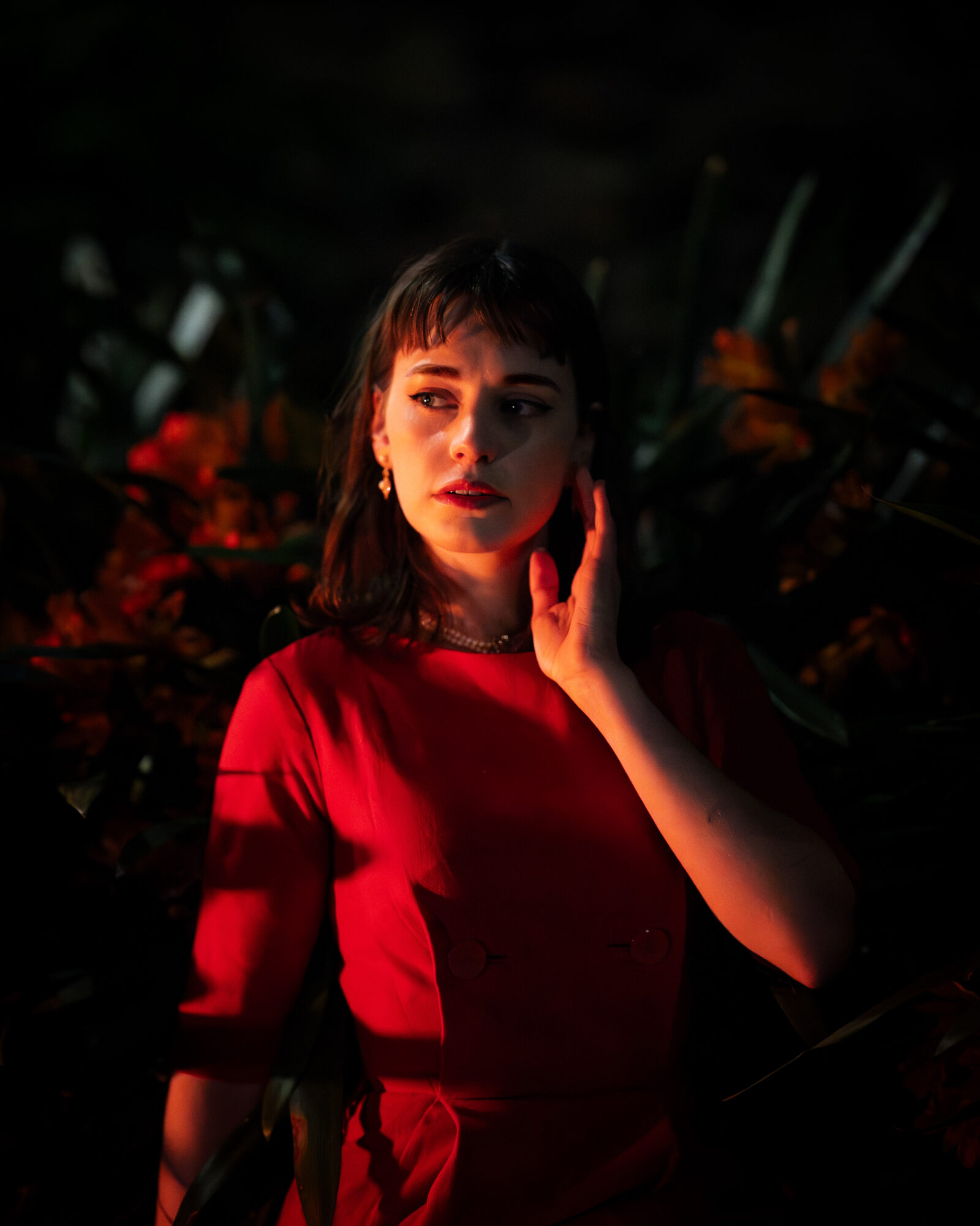 Editorial portrait in warm red light