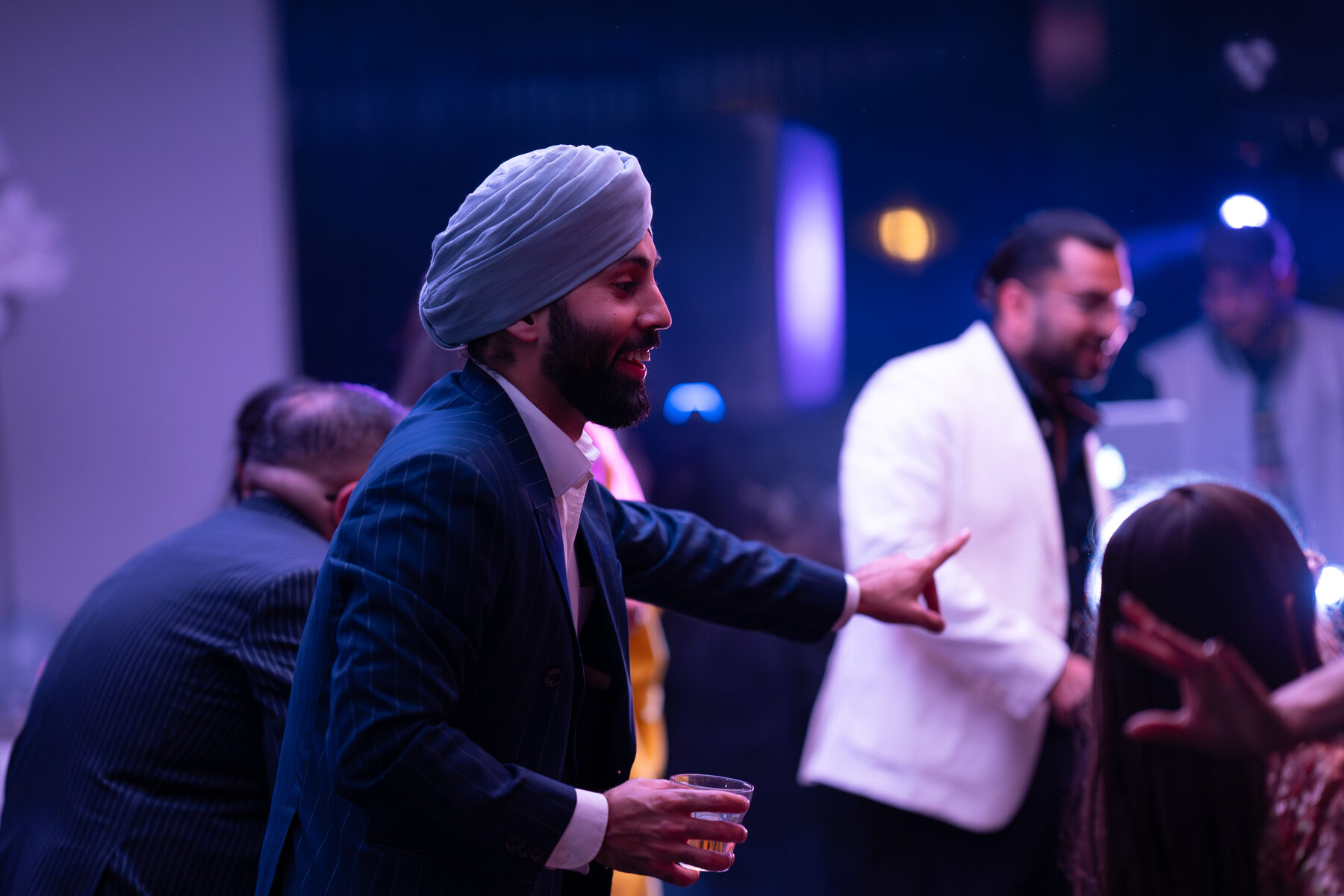 Cinematic dance floor moment in blue and amber light