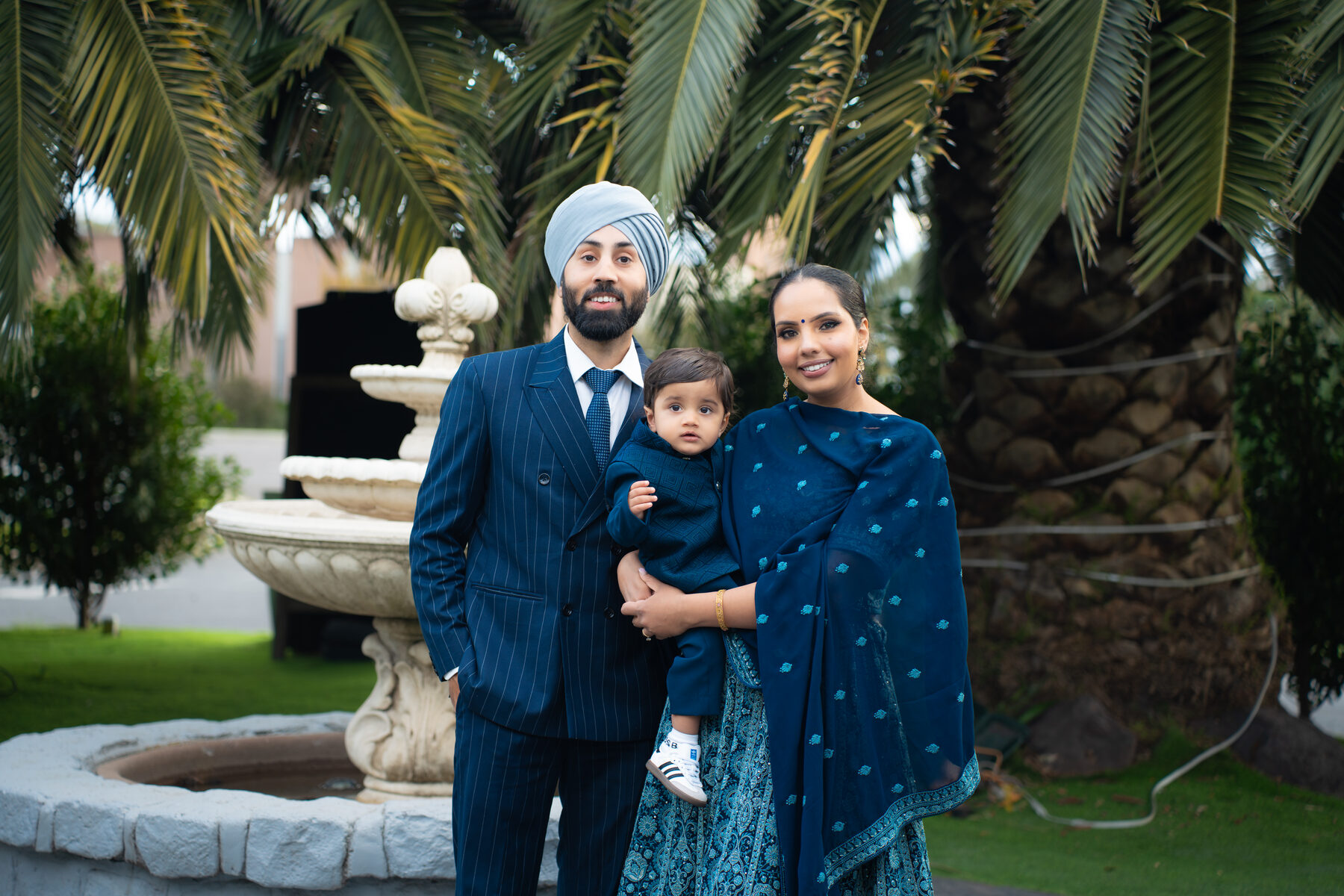 Sikh family portrait in coordinated navy outfits